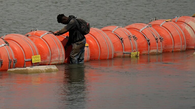 Rio Grande buoys installed by Texas ordered to be removed as overwhelmed Arizona border crossing closes